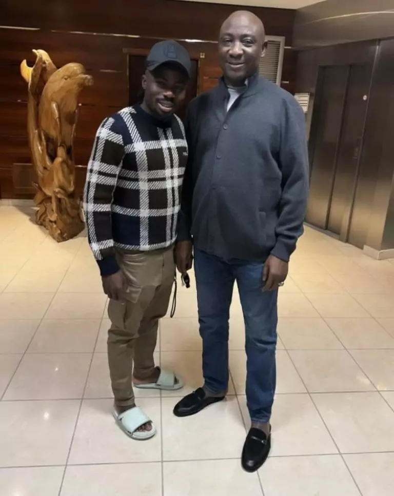 Nigerian football president Ibrahim Gusau checks on Moses Simon's recovery in France