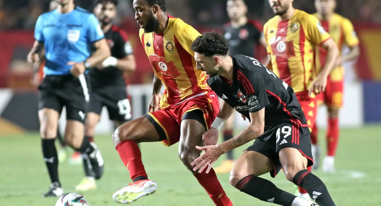 Roger Ben Boris Aholou Of Esperance Tunis Challenged By Wessam Abou Ali Of Al Ahly During The Caf Champions League 2023 24 1st Leg Final Match Between Esperance Tunis And Al Ahly