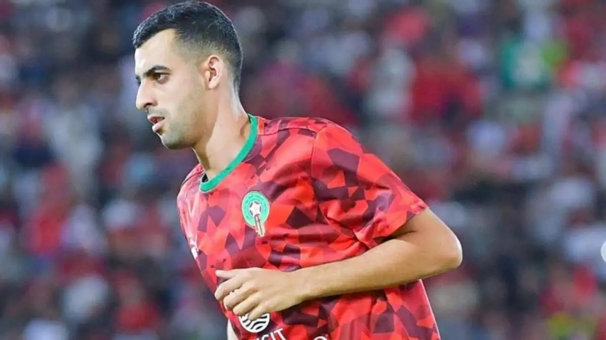  8948a9bd38ebefe20ea06f0223e909038c9e66bdec726d9a72ef9dead074c381 1200 675   AFCON 2025 Raja Casablanca defender Youssef Belammari replaces Romain Saïss in Morocco squad due to injury   AfricaSoccercom