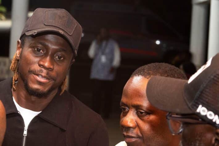 Guinea FGF stands with Issiaga Sylla after arrival of his late wife’s body in Conakry