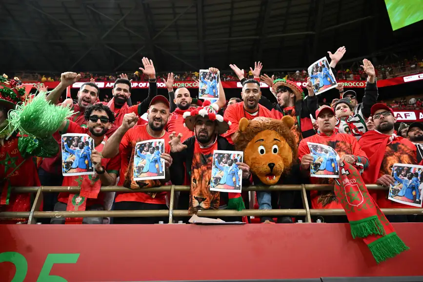 Morocco fans Michel Nkuka Mboladinga AfricaSoccercom Morocco fans Michel Nkuka Mboladinga AFCON 2025 Morocco fans honour DR Congo supporter Michel Nkuka Mboladinga in powerful gesture AfricaSoccercom