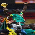 Senegal players celebrating with AFCON trophy