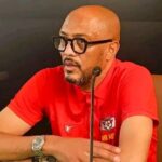 Coach Amir Abdou at a press conference