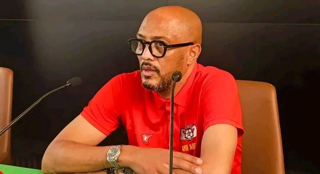 Coach Amir Abdou at a press conference