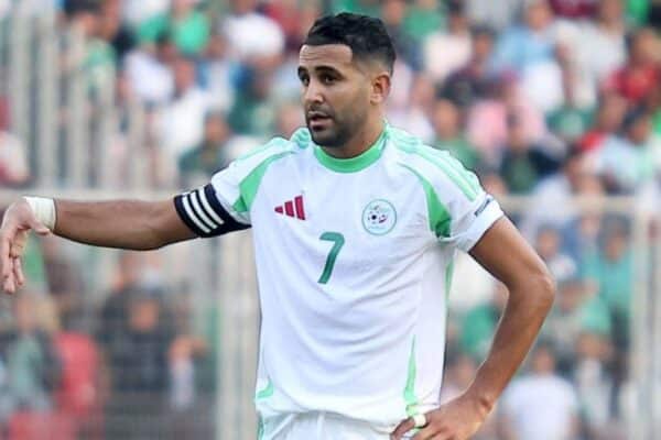 Riyad Mahrez celebrating a goal for Algeria during an international match