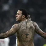 Helicopter arriving near a football stadium before a match