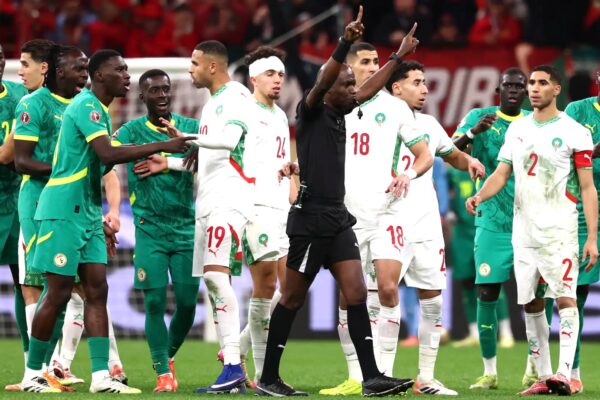 Morocco and Senegal Football players arguing on the field in the AFCON final