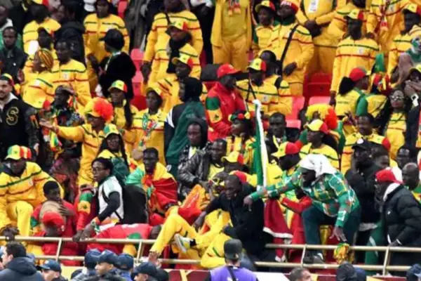 Football supporters in a crowded stadium during AFCON