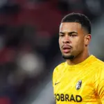 Noah Atubolu celebrates after saving a penalty for Freiburg
