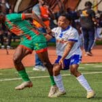 Players from Djoliba and Stade Malien competing for the ball