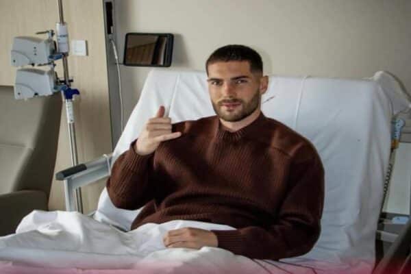 Football player recovering after surgery in hospital