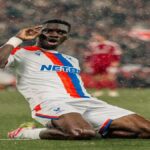 Ismaïla Sarr celebrating after scoring a goal during a match