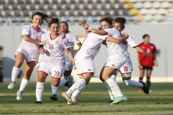 Tunisia women’s team celebrating after scoring in a friendly match
