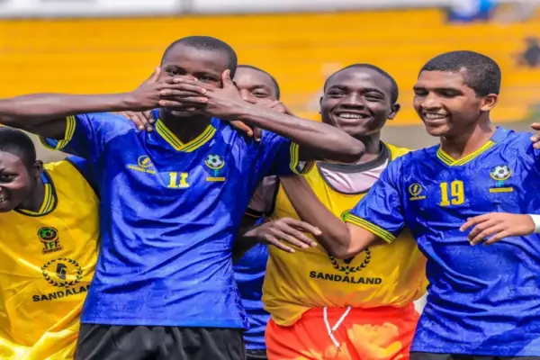 Tanzania U17 players celebrating a goal against Mozambique