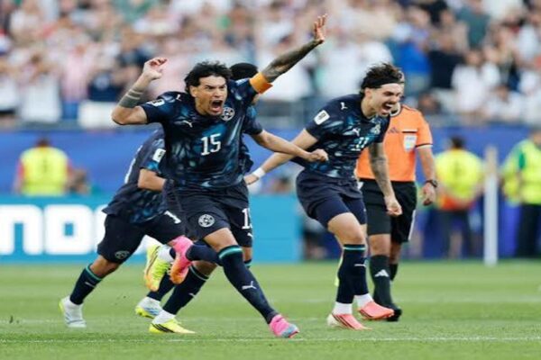 araguay players celebrate after defeating Germany on penalties at the 2026 World Cup.