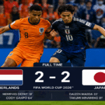 Netherlands and Japan players competing during a World Cup Group F match