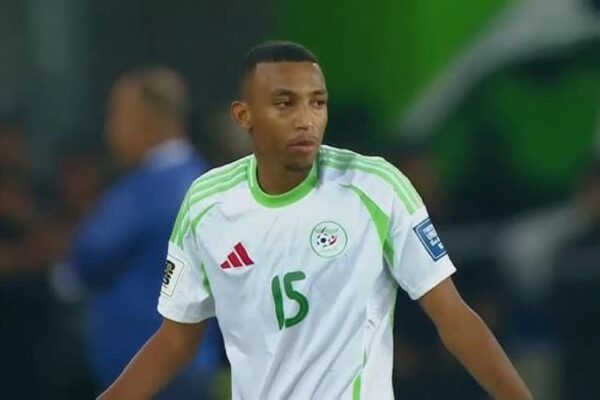 Algeria defender Rafik Belghali speaking to reporters before the World Cup