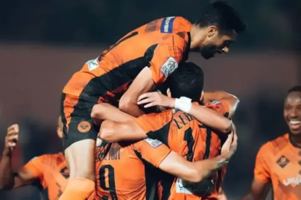 : RS Berkane players celebrate after scoring against Raja Casablanca in the Botola Pro D1