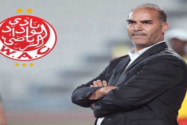 Sami Trabelsi watching Wydad Casablanca during their match at Mohammed V Stadium.