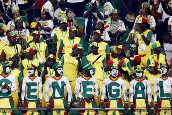 Senegal supporters celebrating in stadium during international football match
