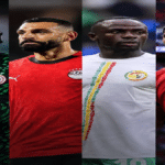 Players from African national teams celebrating during a major international football tournament.