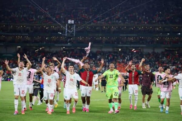 Morocco national team players celebrate during their 2026 World Cup match after reaching the quarter-finals.