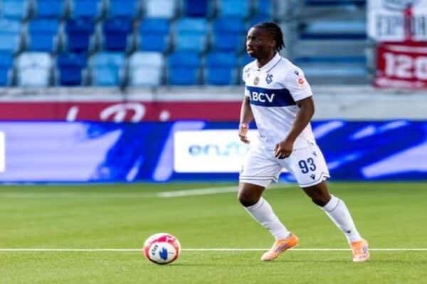 Sékou Fofana poses after signing for AJ Auxerre following his transfer from Lausanne Sport.